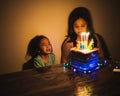 Cute crying little  girl celebrating birthday. Child unhappy for no reason indoor. Photo may contain noise due to low light Royalty Free Stock Photo