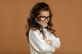 Cute curly little child girl in glasses