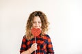 Cute curly long-haired blonde teen girl with closed eyes