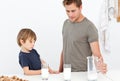 Cute dad and son drinking milk Royalty Free Stock Photo