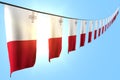 Cute day of flag 3d illustration - many Malta flags or banners hanging diagonal on rope on blue sky background with selective