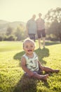 Cute diverse baby boy being watched by his grandparents