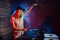 Cute dj woman having fun playing music at club party Royalty Free Stock Photo