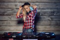 Cute dj woman having fun playing music at club party Royalty Free Stock Photo