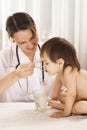 Cute doctor with little girl