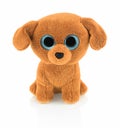 Cute dog doll with blue eyes on white background with shadow reflection. Playful bright brown dog toy sitting on white.