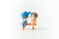 Mini cute doll of Couple little boy and little girl About to kiss isolate on White background