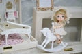 Cute doll. A cute little girl figurine for decoration in a dolly house. Nostalgia concept. Soft focus, Vintage