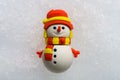 Cute doll of snowman on snow Royalty Free Stock Photo