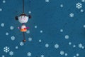 Cute doll and water drop or rain on mirror and snow blue background
