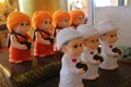 Cute dolls, nuns and monks in Thai temples