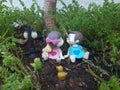 Cute dolls sitting in garden with ducklings with street lights love picture