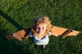 Cute dreamer boy playing with a cardboard airplane. Childhood. Fantasy, imagination. Royalty Free Stock Photo