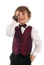 Cute dressed up boy speaking over portable radio