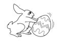 A cute Easter bunny is pushing a beautiful egg. Black and white hand drawn doodle vector illustration. Perfect for antistress book Royalty Free Stock Photo