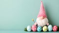 Cute Easter Gnome with Pastel Eggs on Mint Green Background Royalty Free Stock Photo