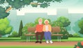 Cute elderly couple is sitting on a bench in a city park. Seniors rest outdoors