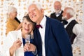 Elegant senior couple toasting with champagne during New Year`s Eve Royalty Free Stock Photo