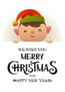 Cute elf stands behind signboard advertisement banner with text Merry Christmas and Happy New Year Royalty Free Stock Photo