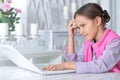 Portrait of cute little girl using modern laptop Royalty Free Stock Photo