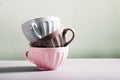 Cute empty ceramic coffee cups pastel colors and rowan branch