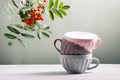 Cute empty ceramic coffee cups pastel colors and rowan branch