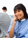 Cute ethnic businesswoman on phone