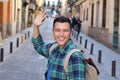 Cute ethnic guy saluting outdoors Royalty Free Stock Photo