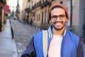 Cute ethnic hipster wearing eyeglasses and hat