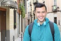 Cute ethnic young man smiling outdoors