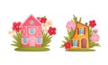 Cute fabulous houses surrounded by grass and flowers set. Little house of gnome or elf cartoon vector illustration