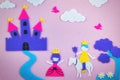 Cute fairy tale scene in felt with a princess and a prince in love in front of a fantasy castle