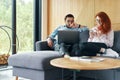 Cute family couple working together in cozy living room Royalty Free Stock Photo