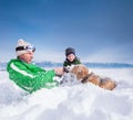 Cute family scene: father and son play with dog during mountain