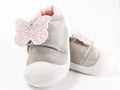 Cute and fancy baby girl sneakers isolated on white