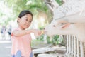 Cute farmer girl feeding baby goat