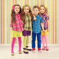 Cute fashion kids are standing together.
