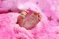 Cute feet of newborn baby on the blanket. The concept of love, health and care Royalty Free Stock Photo