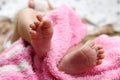 Cute feet of newborn baby on the blanket. The concept of love, health and care Royalty Free Stock Photo