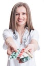 Cute female doctor offering pill tablets Royalty Free Stock Photo