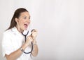 Cute female doctor with a stethoscope sings