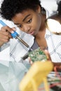 cute female engineer at home working on technology Royalty Free Stock Photo