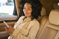 Cute female travels in the back seat of a car Royalty Free Stock Photo