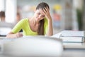 Cute female university/highschool student in library Royalty Free Stock Photo