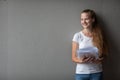 Cute female student with books in library Royalty Free Stock Photo