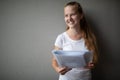 Cute female student with books in library Royalty Free Stock Photo