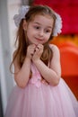 Cute five year old girl in a pink princess dress. portrait of a happy cute blonde girl 5 years old Royalty Free Stock Photo