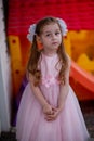 Cute five year old girl in a pink princess dress. portrait of a happy cute blonde girl 5 years old Royalty Free Stock Photo