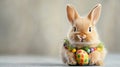 a cute fluffy baby rabbit dressed in colorful easter egg decorations Royalty Free Stock Photo