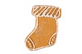 Cute fresh gingerbread christmas sock decorated with royal icing, isolated on white background. Christmas food, pastry background